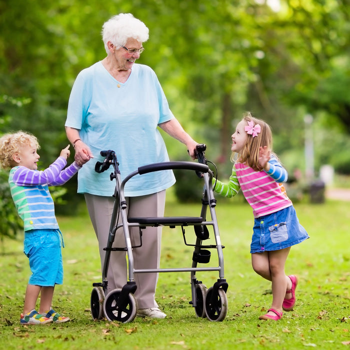 Older couple out and about with mobility aids on a summer trip in New Zealand