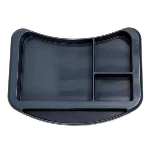 iCare organiser tray sitting on an over bed table holding a cup and a book
