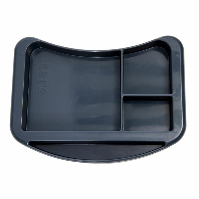 iCare organiser tray sitting on an over bed table holding a cup and a book