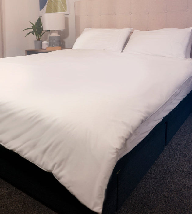 Waterproof Duvet Protector with Clips on bed