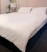 Waterproof Duvet Protector with Clips on bed