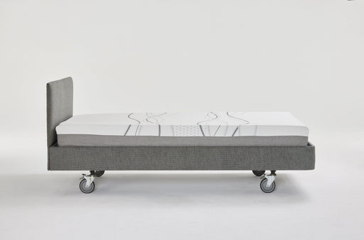 Side profile of the iCare IC100 partner bed showing its fixed 35.5cm platform height and castors